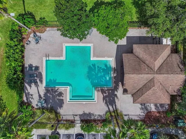 an aerial view of house with yard