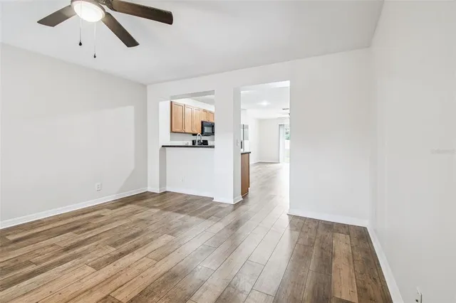 a view of a livingroom with wooden floor