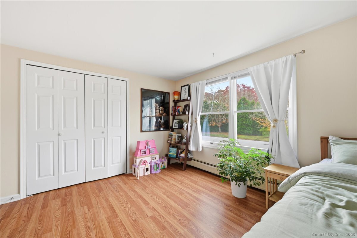 198 Dartmouth Drive Groton, CT 06355 - Photo 11 of 25 a bedroom with furniture and a window
