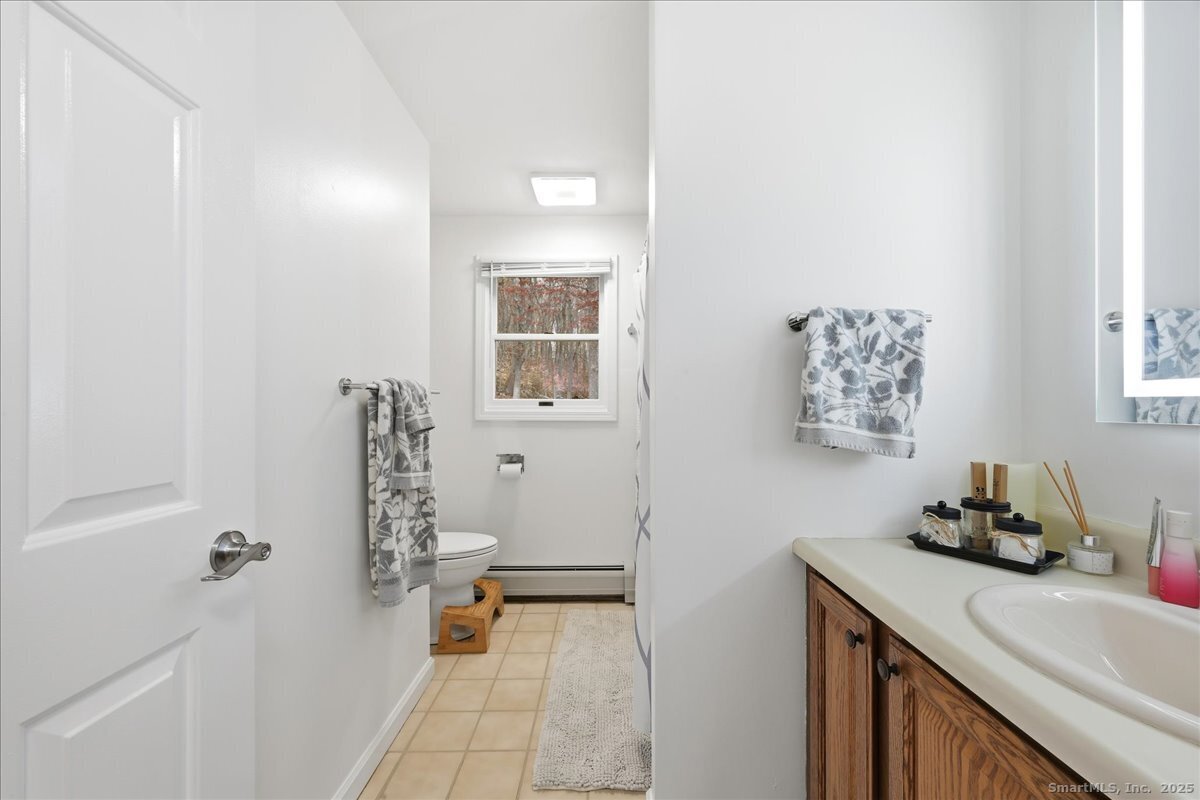 198 Dartmouth Drive Groton, CT 06355 - Photo 13 of 25 a bath room with a sink