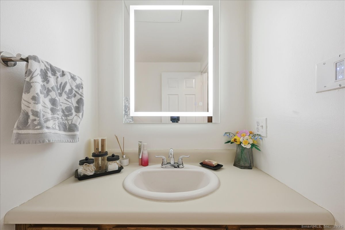 198 Dartmouth Drive Groton, CT 06355 - Photo 14 of 25 a bathroom with a sink and a window