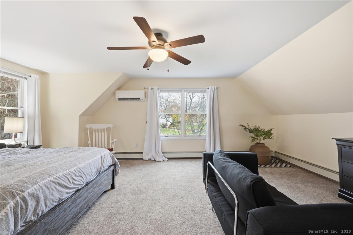 198 Dartmouth Drive Groton, CT 06355 - Photo 16 of 25 a bedroom with a bed and a large window