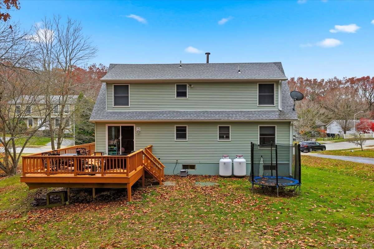 198 Dartmouth Drive Groton, CT 06355 - Photo 20 of 25 a backyard of a house with yard and outdoor seating