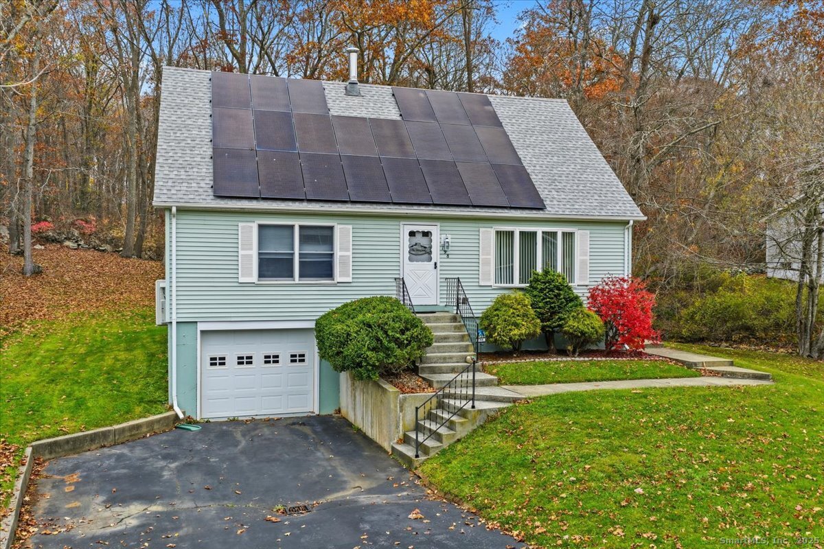 198 Dartmouth Drive Groton, CT 06355 - Photo 2 of 25 a front view of a house with a yard and potted plants