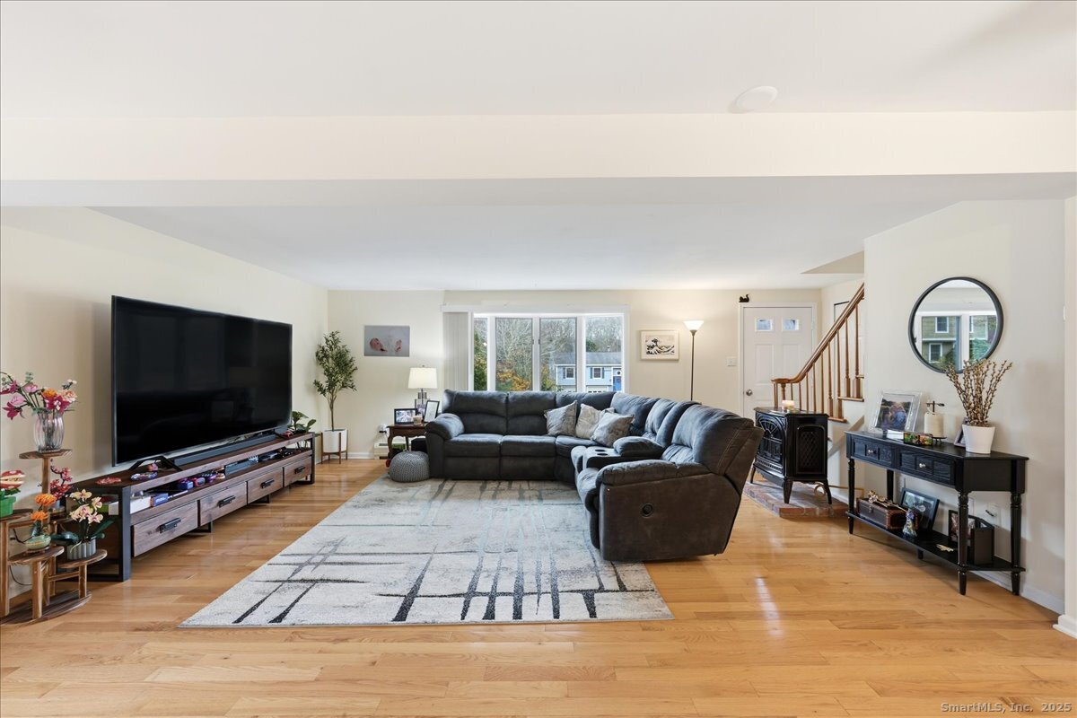 198 Dartmouth Drive Groton, CT 06355 - Photo 6 of 25 a living room with furniture and a flat screen tv