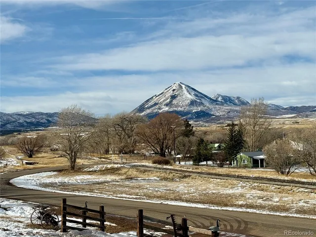 a view of a town with mountains in the background