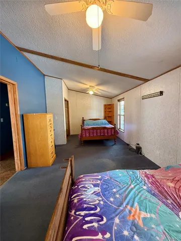 a living room with a bed and furniture