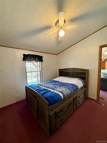 a bathroom with a sink a toilet a mirror and shower