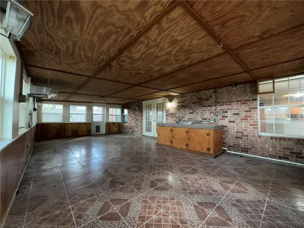 a view of empty room with windows