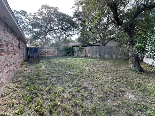 a view of a backyard with a trees
