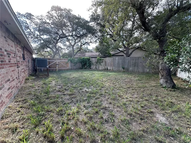 a view of a backyard with a trees