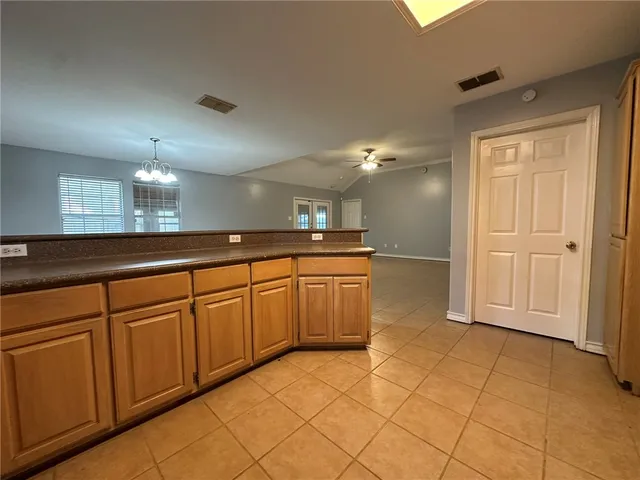 a spacious bathroom with a sink a mirror and a shower