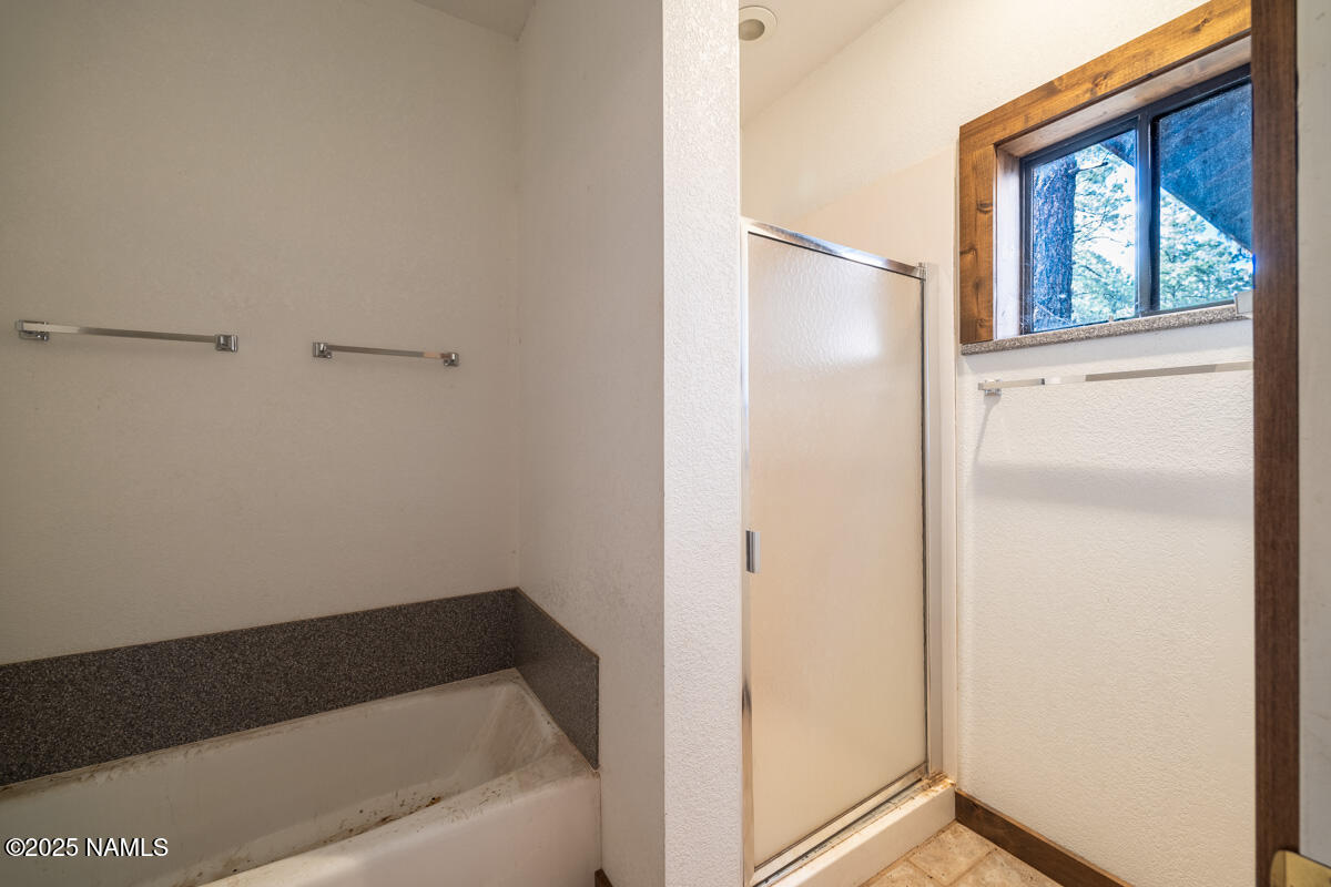 129 North Spitz Spring Road Parks, AZ 86018 - Photo 15 of 59 a bathroom with a bathtub