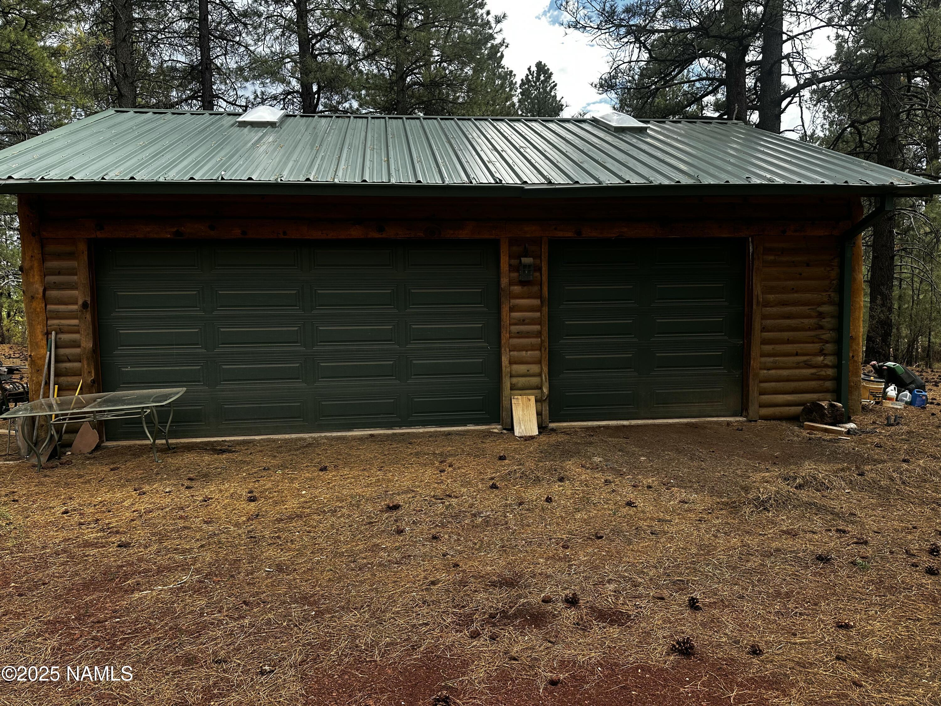 129 North Spitz Spring Road Parks, AZ 86018 - Photo 2 of 59 a front view of a house with a yard