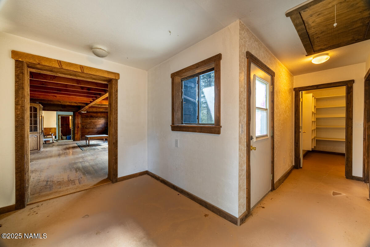 129 North Spitz Spring Road Parks, AZ 86018 - Photo 23 of 59 a view of a hallway with bathroom