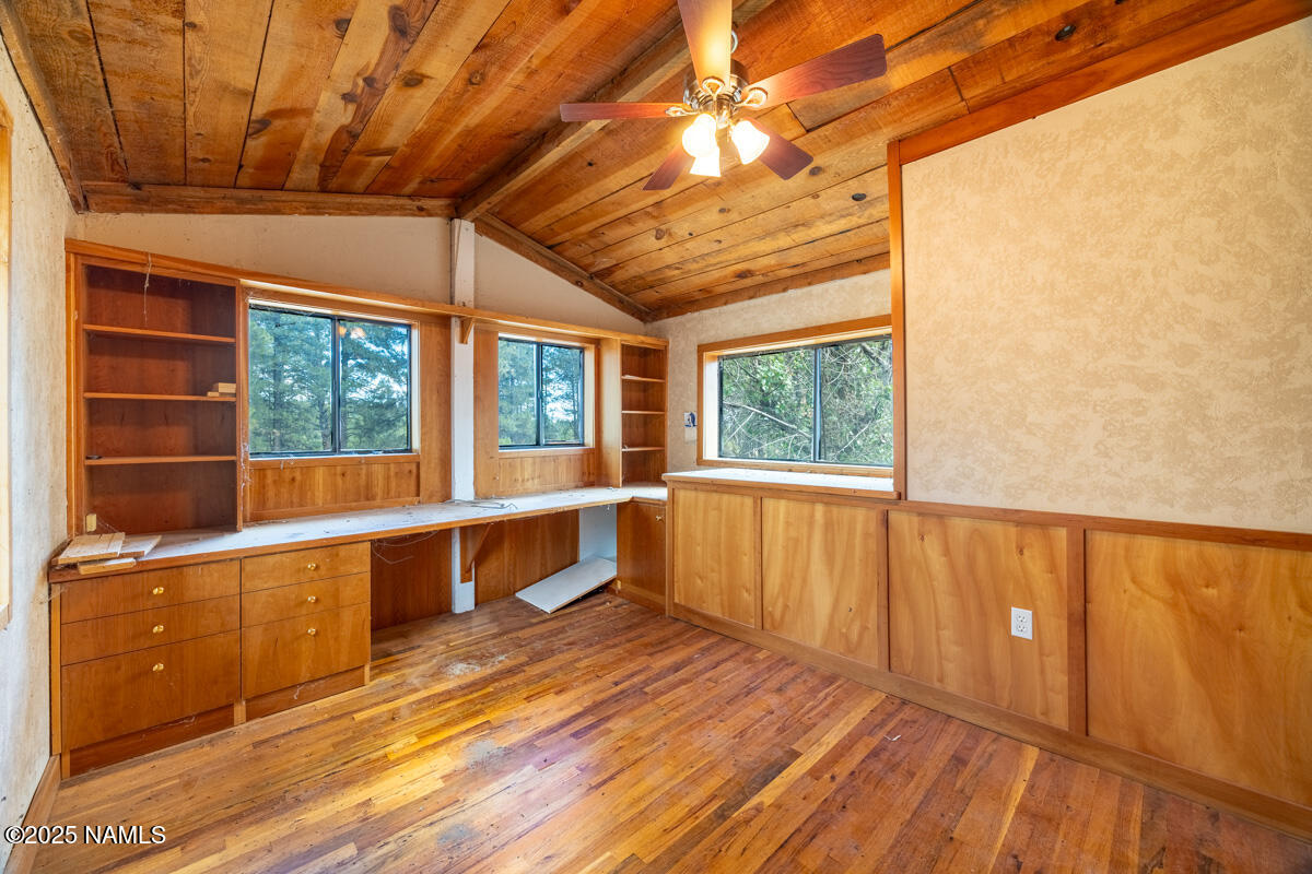129 North Spitz Spring Road Parks, AZ 86018 - Photo 30 of 59 a view of a balcony with wooden floor and iron stairs