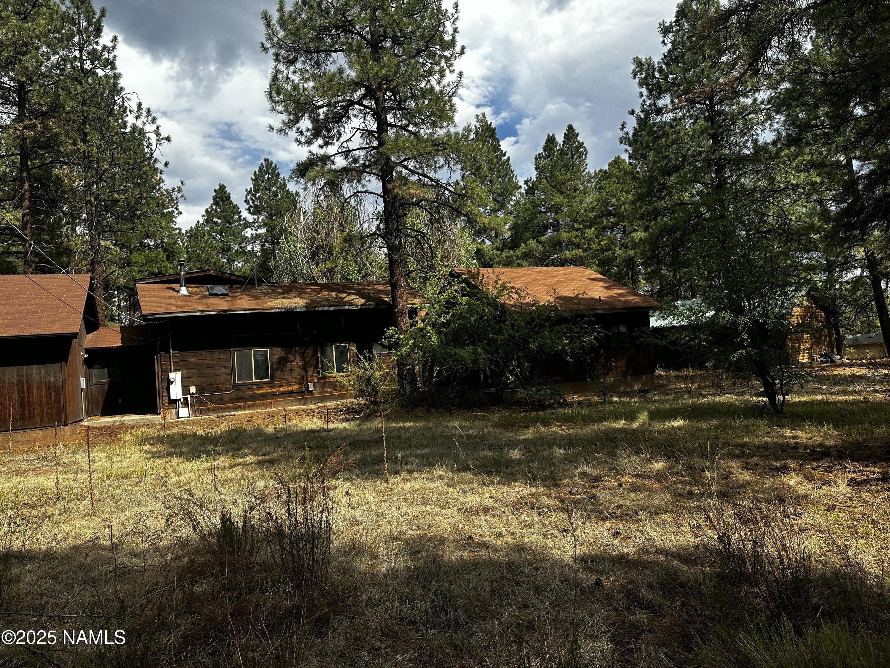 129 North Spitz Spring Road Parks, AZ 86018 - Photo 3 of 59 a view of a house with a yard