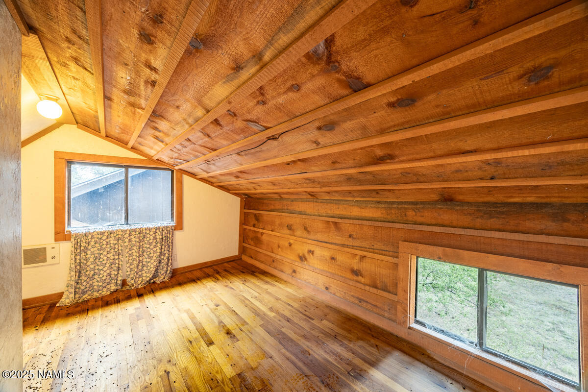129 North Spitz Spring Road Parks, AZ 86018 - Photo 33 of 59 a view of empty room with wooden floor and fan