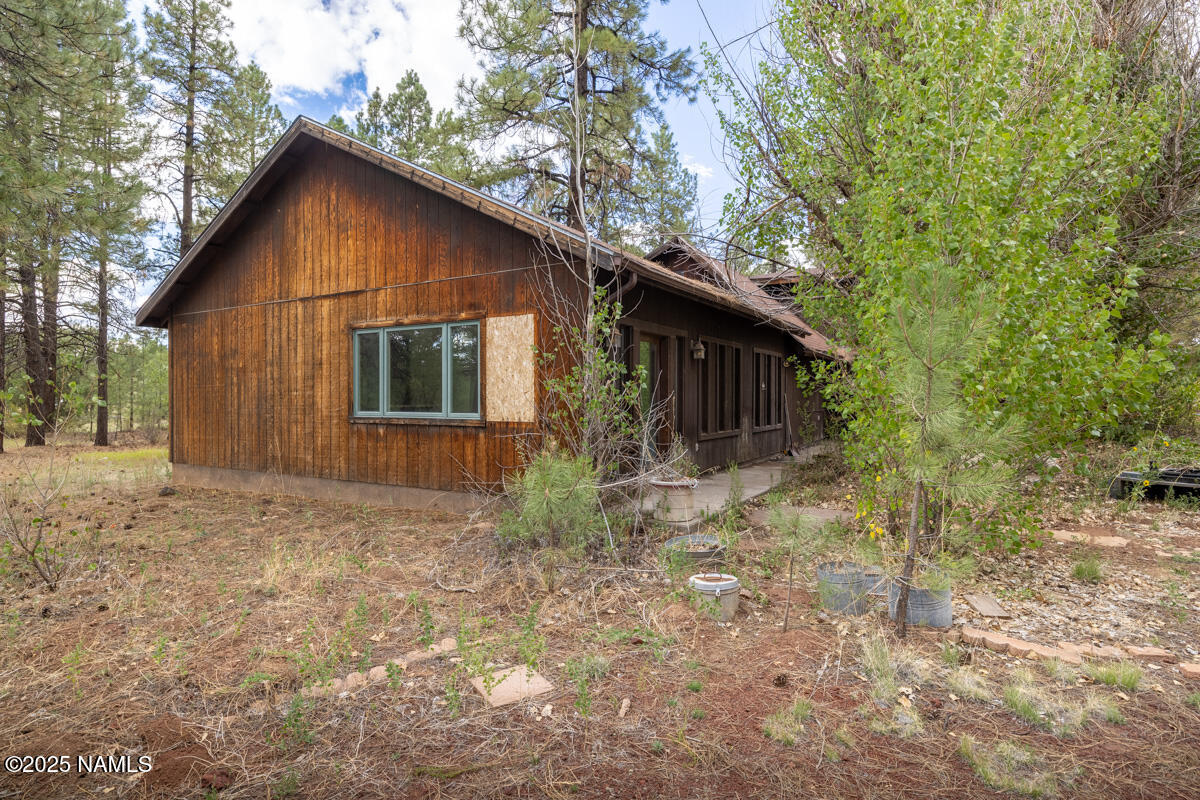 129 North Spitz Spring Road Parks, AZ 86018 - Photo 38 of 59 a house with trees in the background