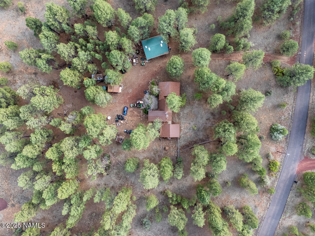 129 North Spitz Spring Road Parks, AZ 86018 - Photo 44 of 59 an aerial view of a house with a yard and garden