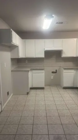 a view of a kitchen with a sink and dishwasher in it