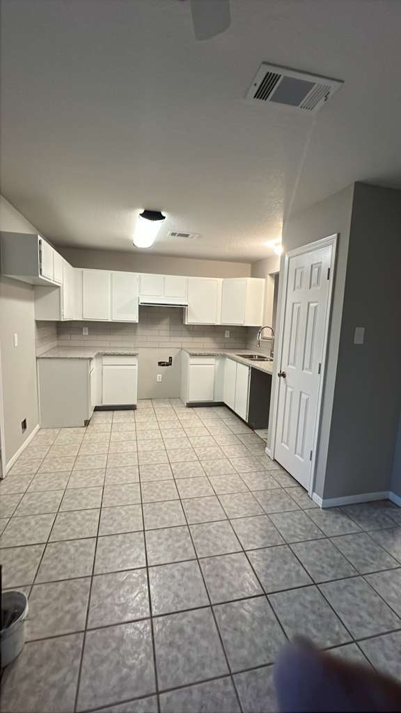 8617 Mapletwist Street Houston, TX 77083 - Photo 10 of 11 a room with a cabinets and counter space