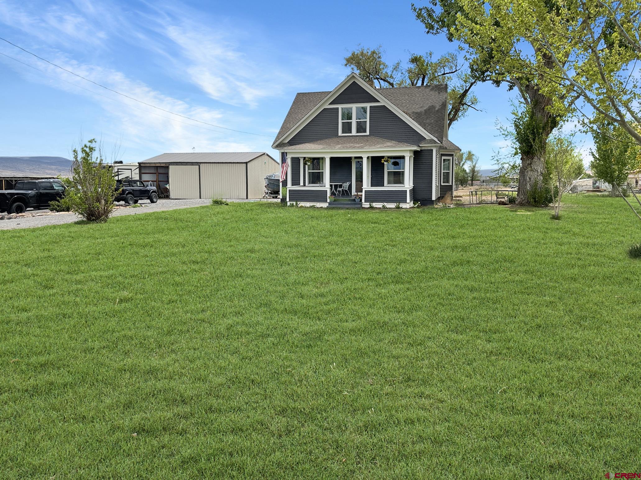 20570 Iris Road Austin, CO 81410 - Photo 1 of 35 a front view of a house with a yard