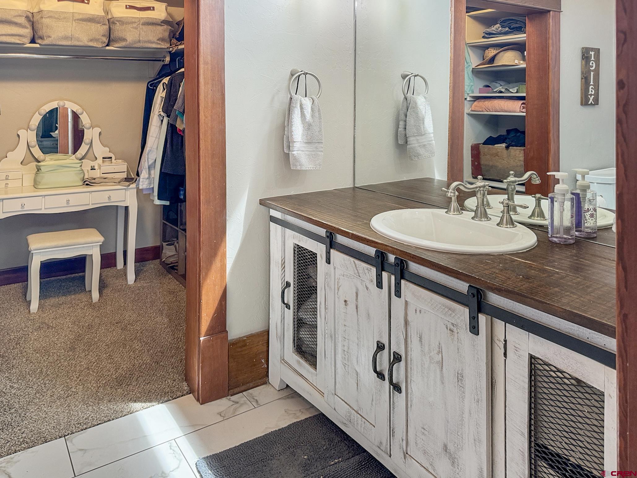 20570 Iris Road Austin, CO 81410 - Photo 14 of 35 a bathroom with a sink and a mirror