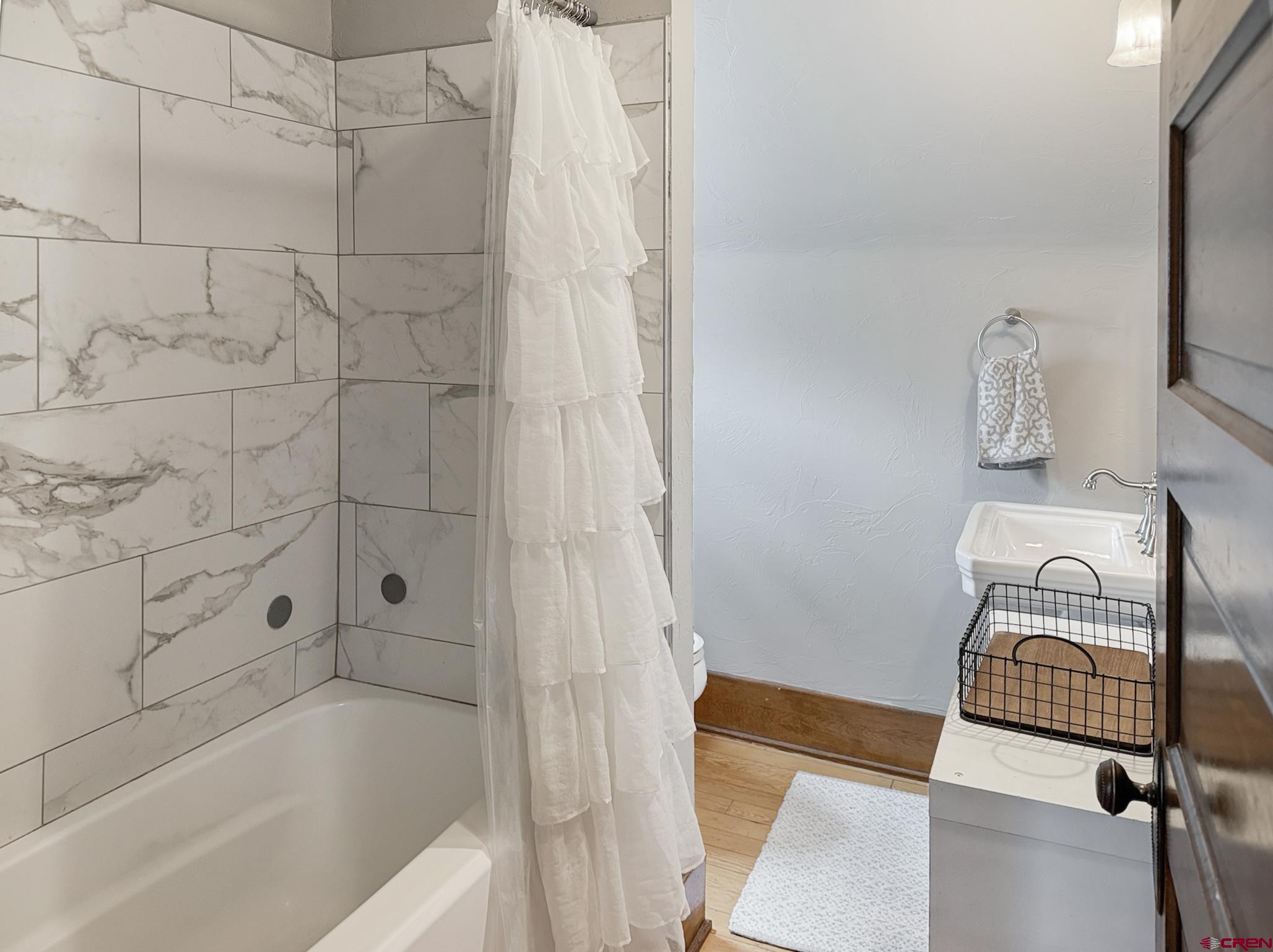 20570 Iris Road Austin, CO 81410 - Photo 18 of 35 a bathroom with a bathtub and shower