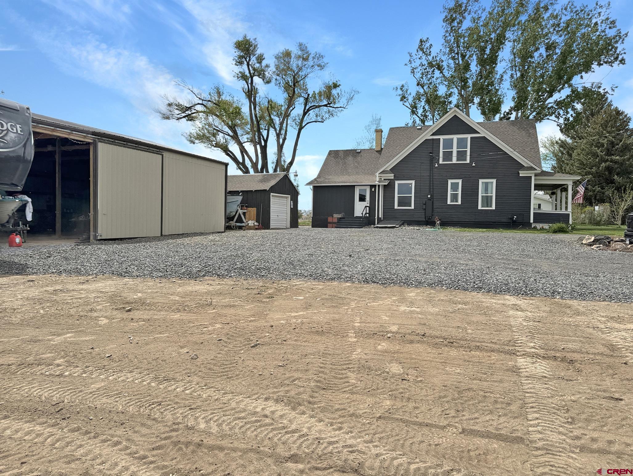 20570 Iris Road Austin, CO 81410 - Photo 23 of 35 a front view of a house with a yard and garage