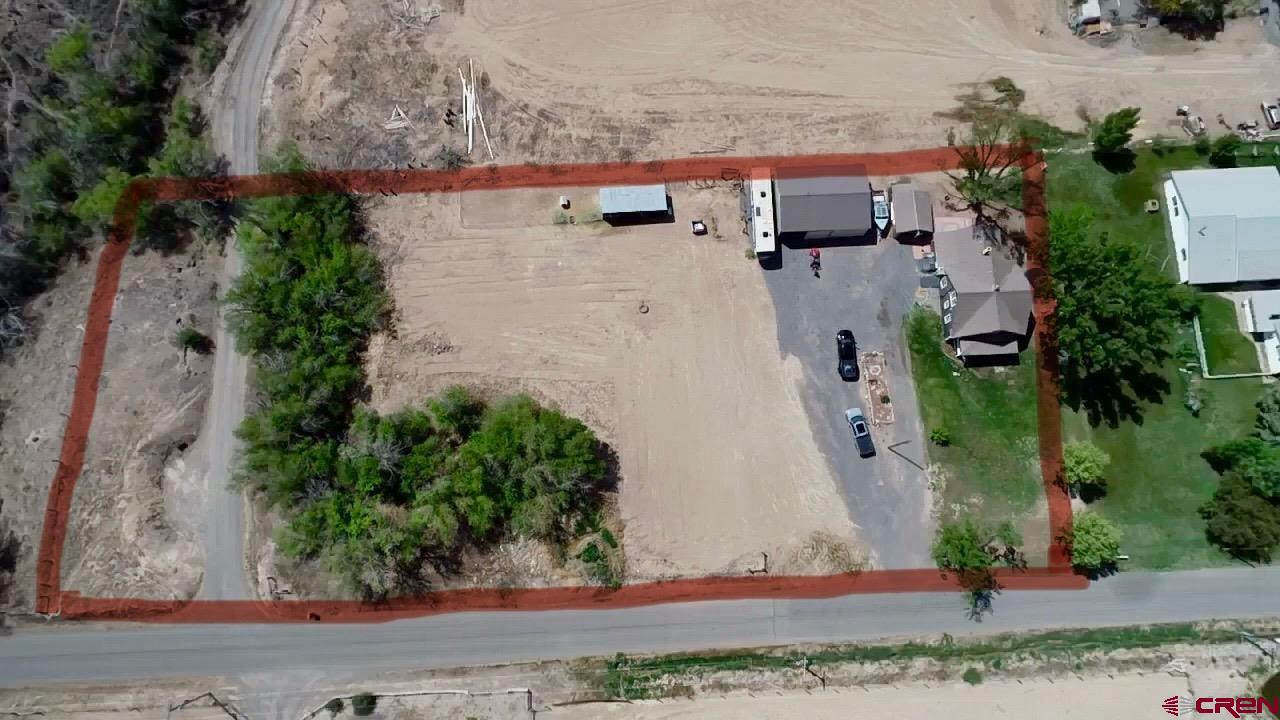 20570 Iris Road Austin, CO 81410 - Photo 25 of 35 an aerial view of a house with a yard and large tree