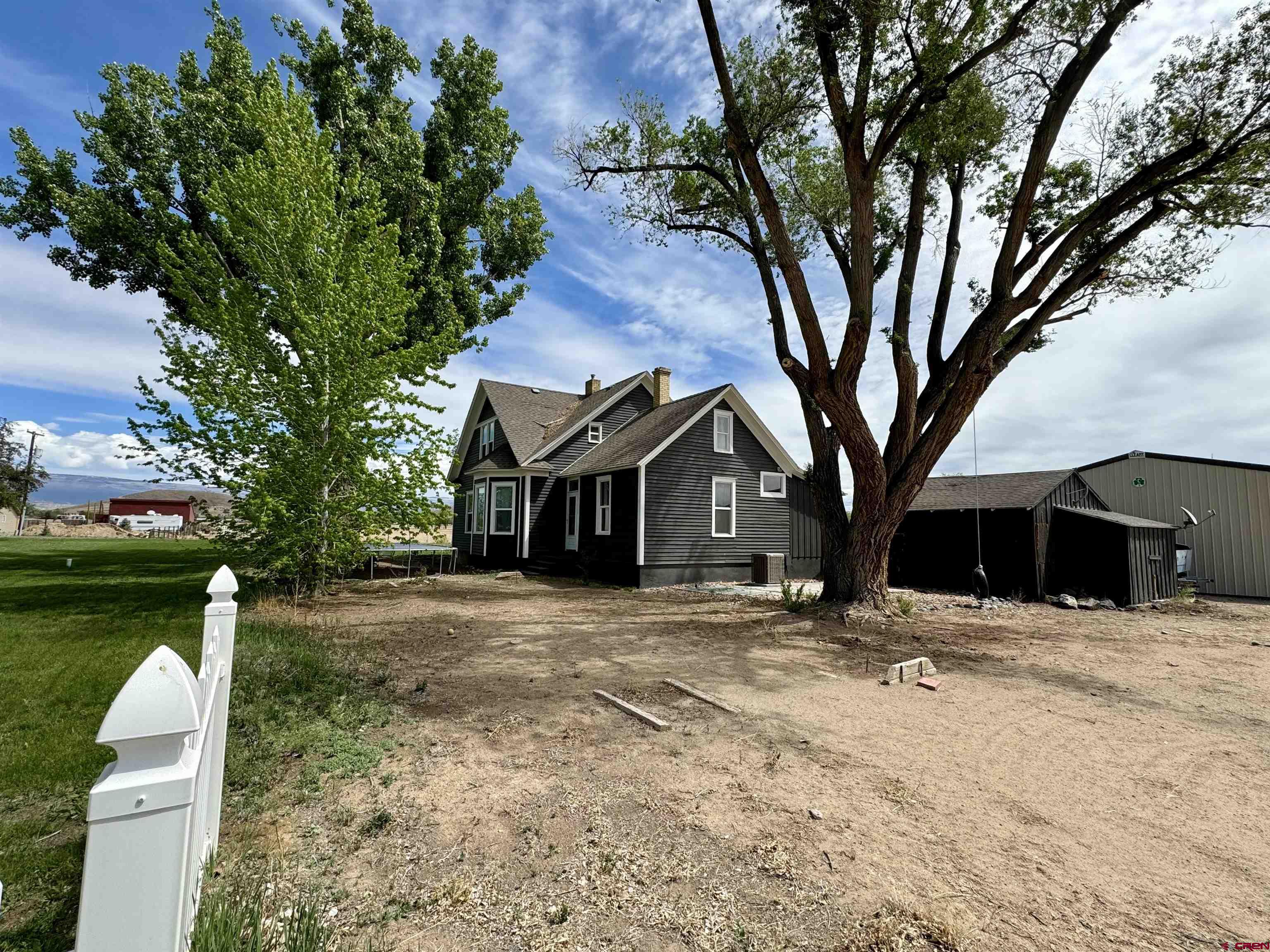 20570 Iris Road Austin, CO 81410 - Photo 28 of 35 a front view of a house with a yard