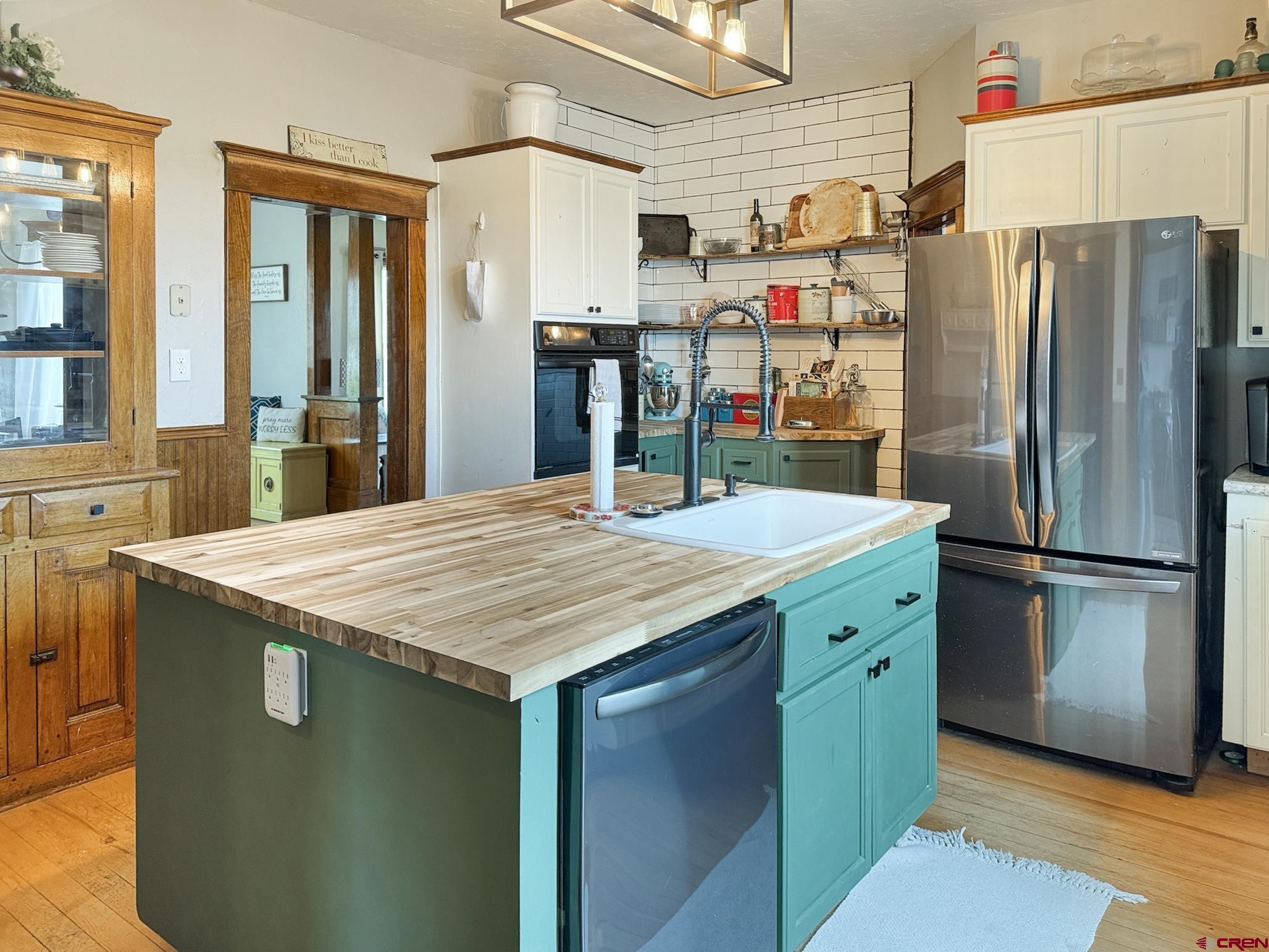 20570 Iris Road Austin, CO 81410 - Photo 3 of 35 a kitchen with stainless steel appliances a refrigerator and a stove