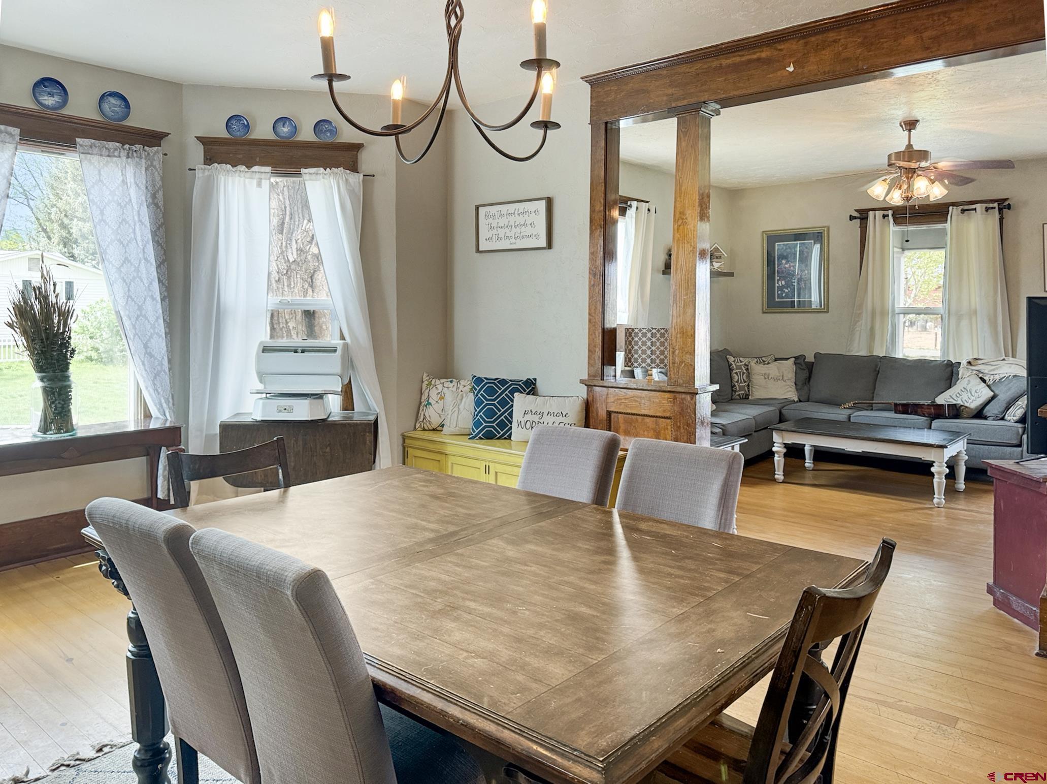 20570 Iris Road Austin, CO 81410 - Photo 7 of 35 a view of a dining room with furniture window and wooden floor