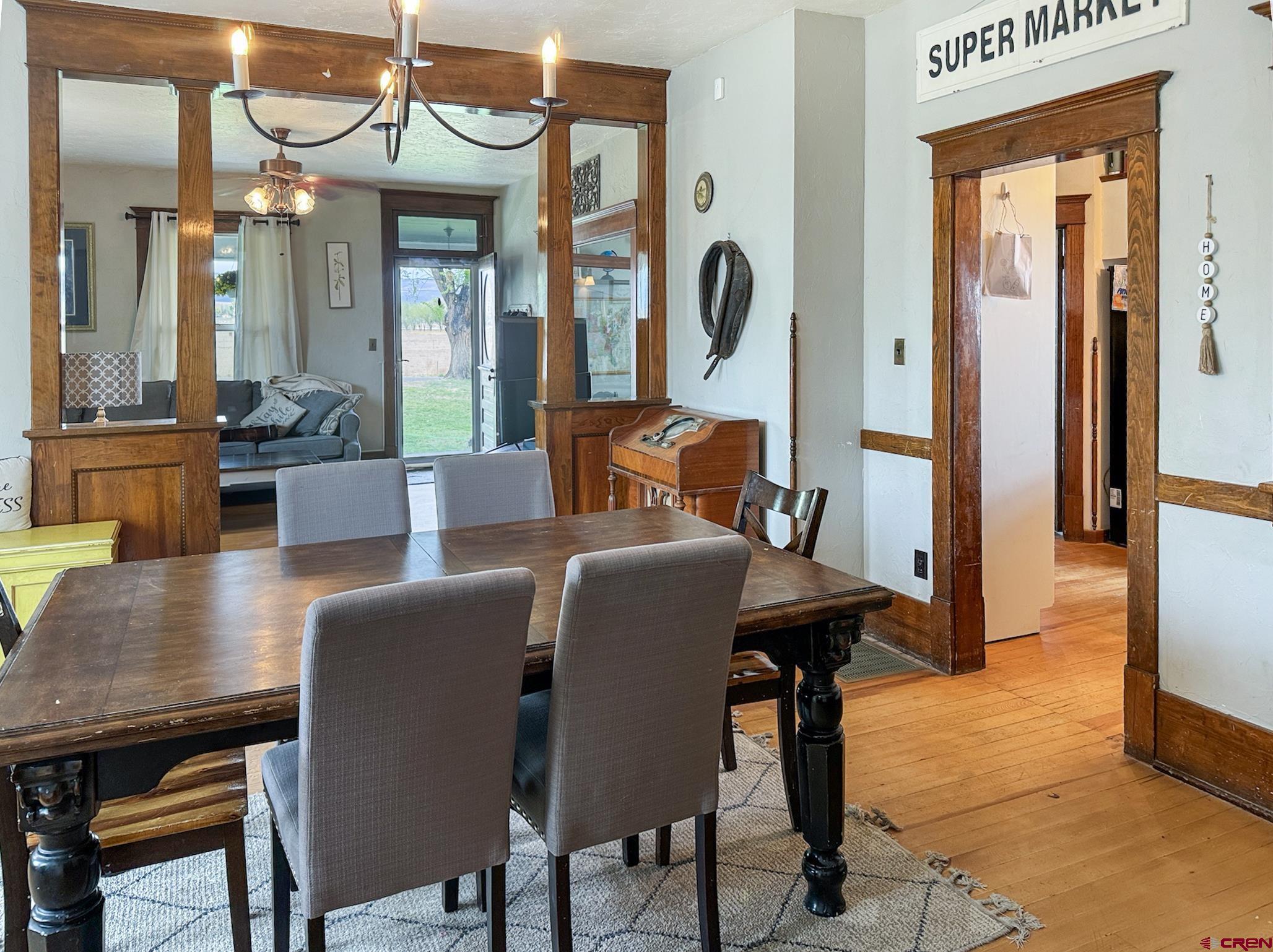 20570 Iris Road Austin, CO 81410 - Photo 8 of 35 a dining room with furniture and wooden floor