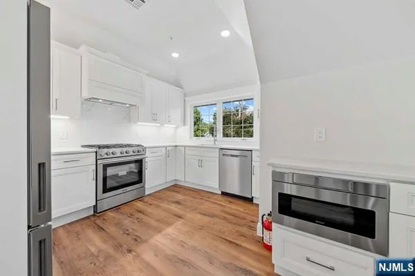a kitchen with a stove and a microwave