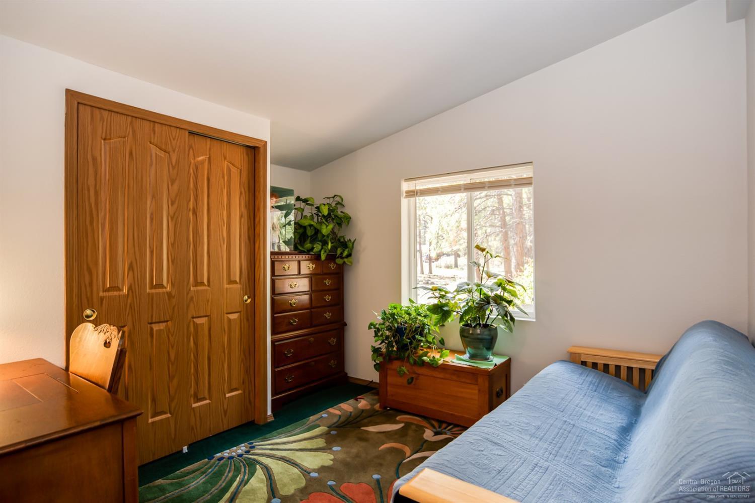 19047 Choctaw Road Bend, OR 97702 - Photo 12 of 23 a view of a livingroom with furniture and front door