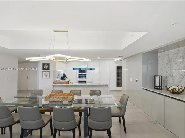 a bedroom with a large bed and a large window