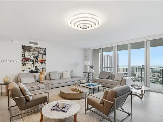 a bedroom with a bed and glass window