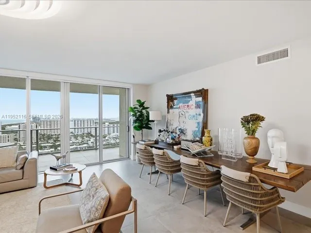 a spacious bathroom with a double vanity sink a mirror and a bathtub