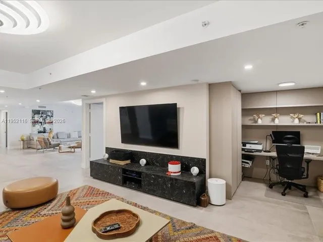 an aerial view of a house with a lake view