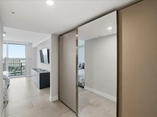 a view of a dining hall with furniture and wooden floor