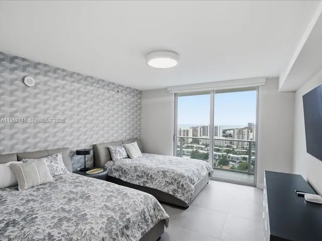 a view of a patio with couches table and chairs and potted plants