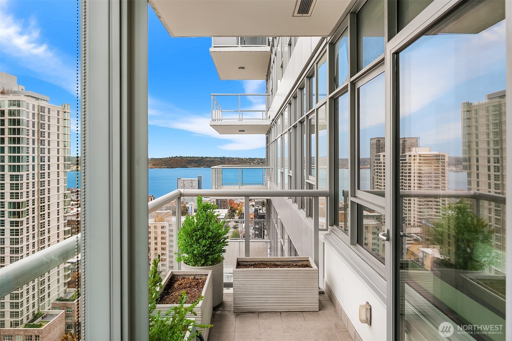 a view of a balcony with city view