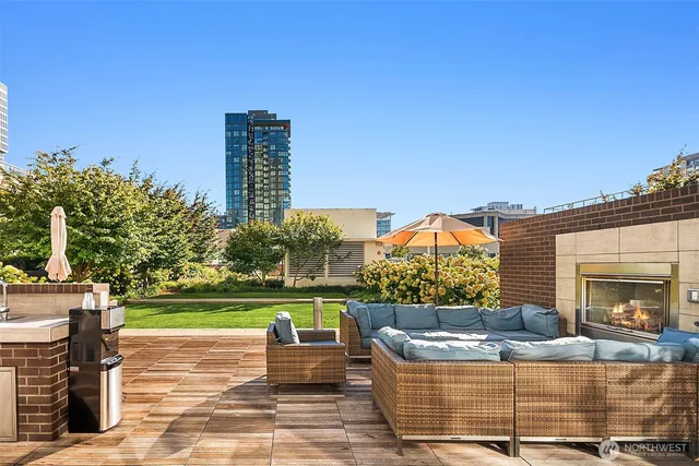 a view of a two chairs and a table in the patio