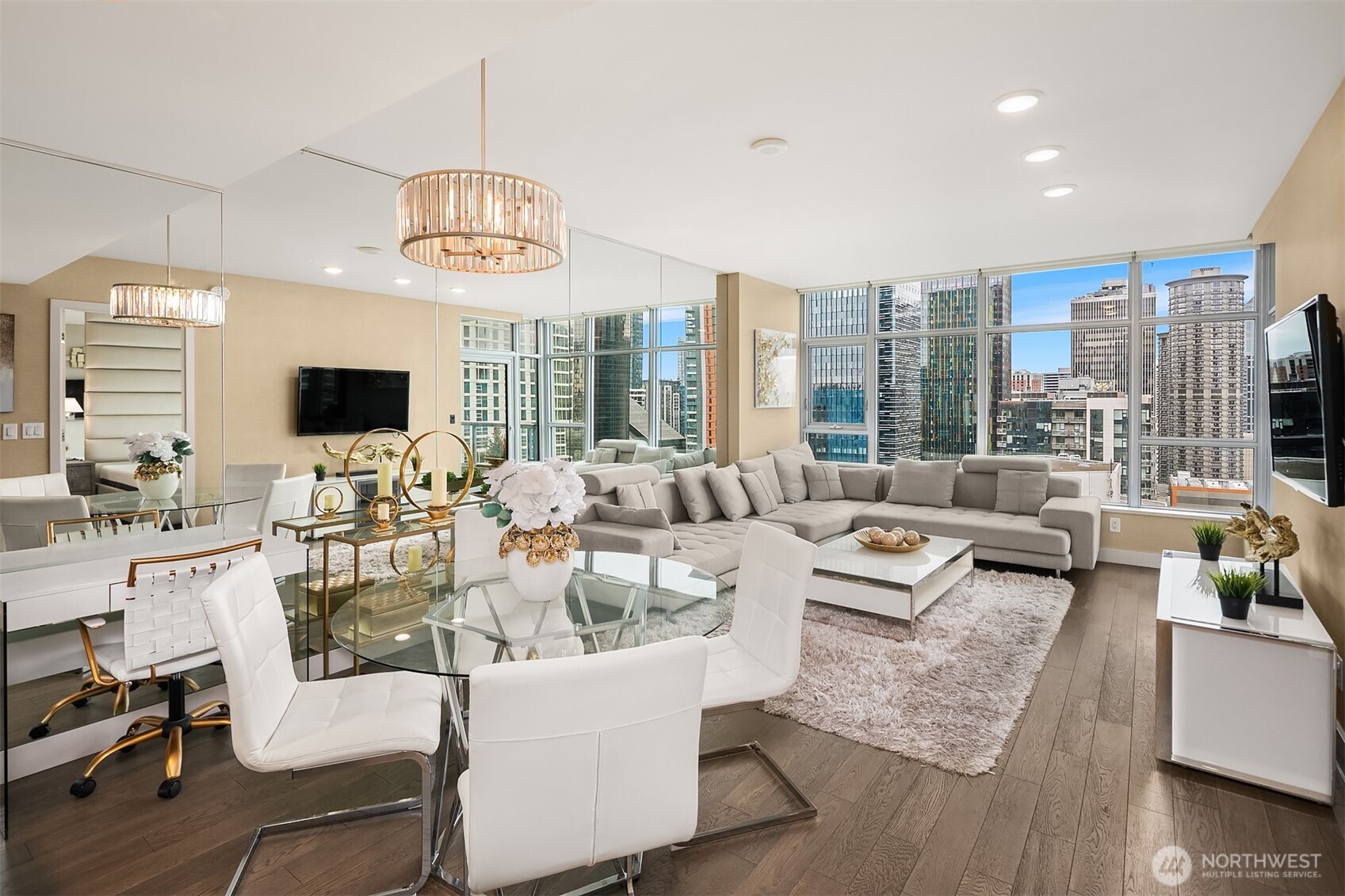 588 Bell Street, Unit 2405S Seattle, WA 98121 - Photo 3 of 34 a living room with fireplace furniture and a flat screen tv