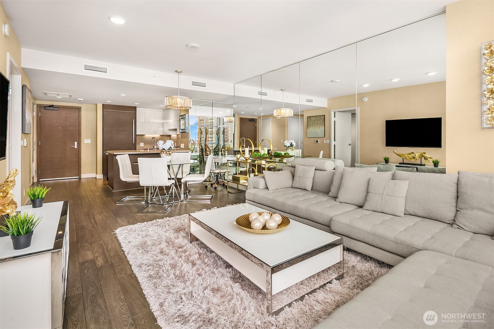 588 Bell Street, Unit 2405S Seattle, WA 98121 - Photo 5 of 34 a living room with furniture a flat screen tv and a large window
