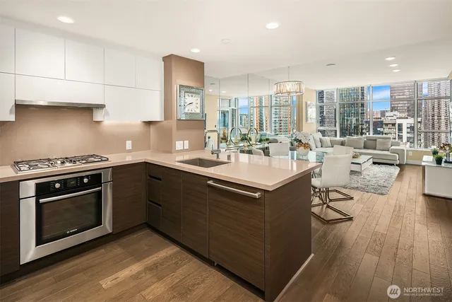 a kitchen with a sink stove and cabinets