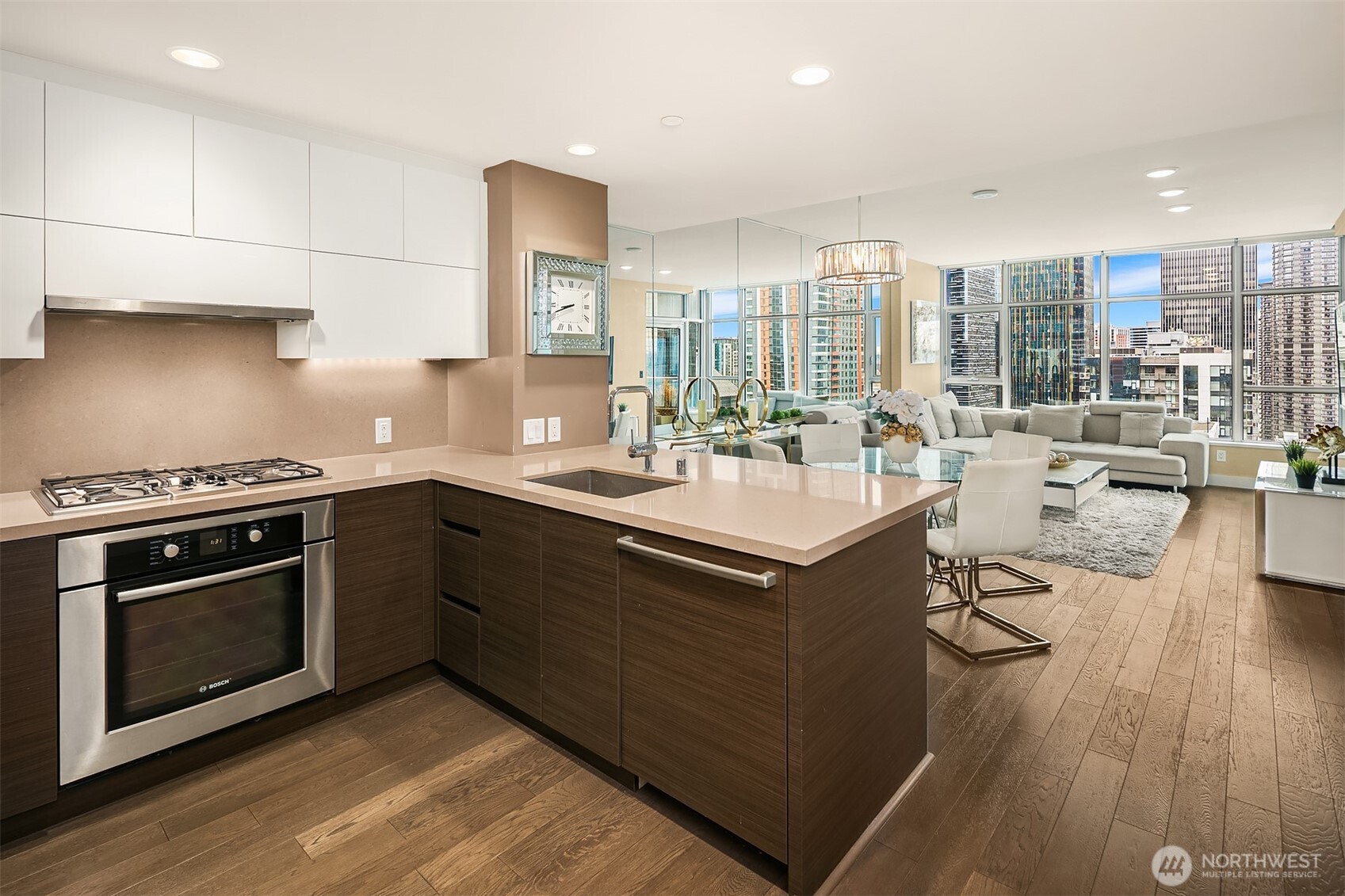 588 Bell Street, Unit 2405S Seattle, WA 98121 - Photo 7 of 34 a kitchen with a sink stove and cabinets