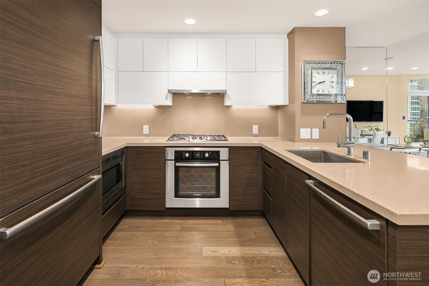 588 Bell Street, Unit 2405S Seattle, WA 98121 - Photo 8 of 34 a kitchen with a stove sink and cabinets